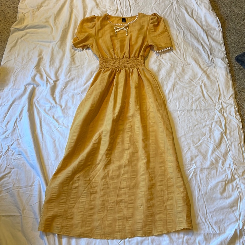 Yellow dress with pearl bow